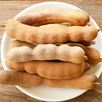 Illustrative image of the article Tamarind: What It Tastes Like, 10 Benefits, Nutrition & Recipes