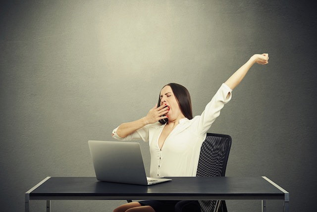 woman stretching and yawning