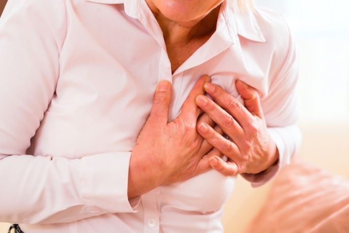 close up of person clutching their chest