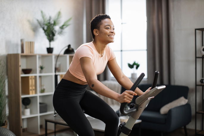 Woman riding stationary bike