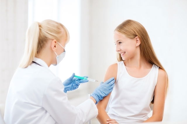 Young woman receiving vaccine