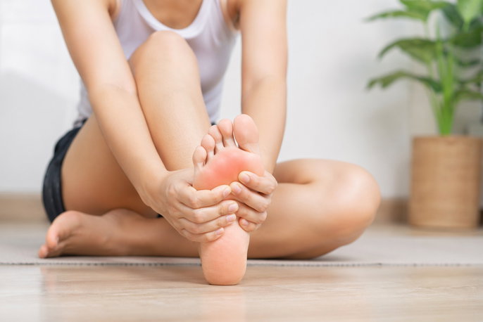 Woman with bottom of foot pain | AI-generated image