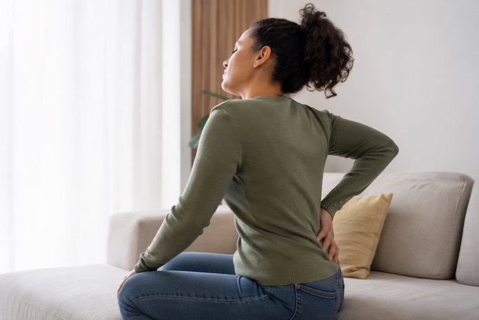 Woman with lower back pain | AI-generated image