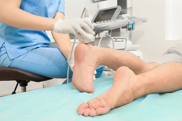 Doctor examining patient's feet