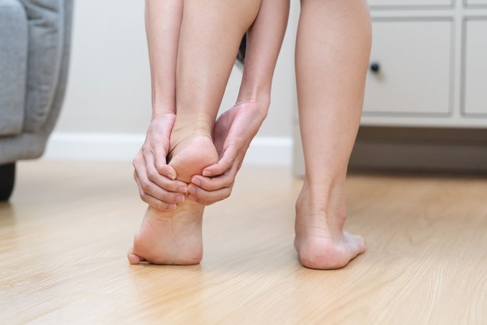 Patient holding heel in pain