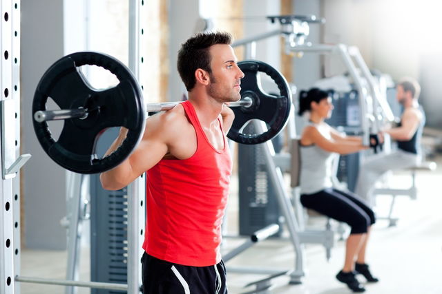 Man doing weight training with a barbell