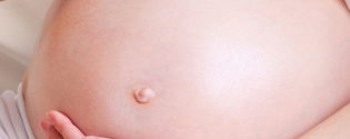 Illustrative image of the article Belly Button Pain During Pregnancy: Top 5 Causes & Relief